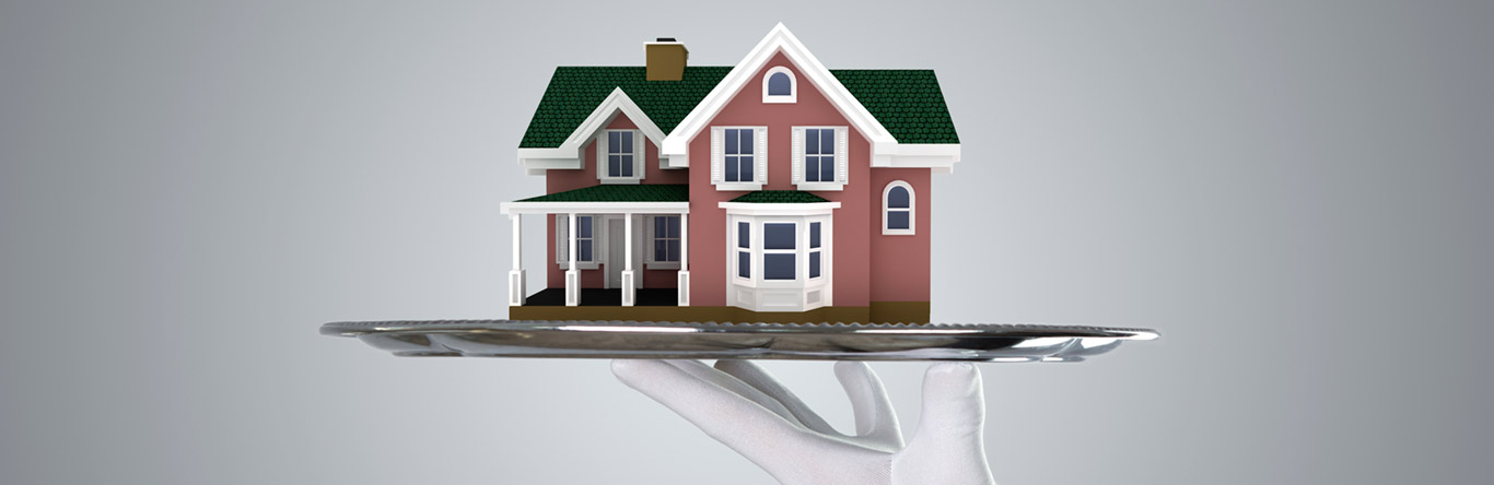 model home on top of silver platter